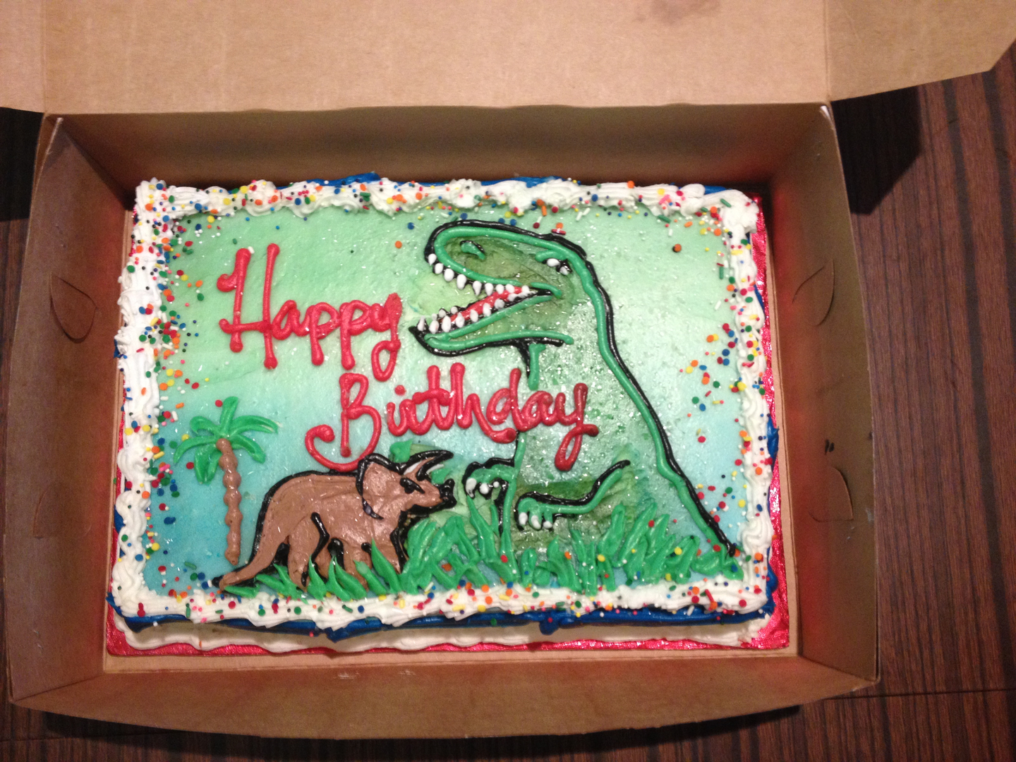 Hand drawn dinosaur birthday cake